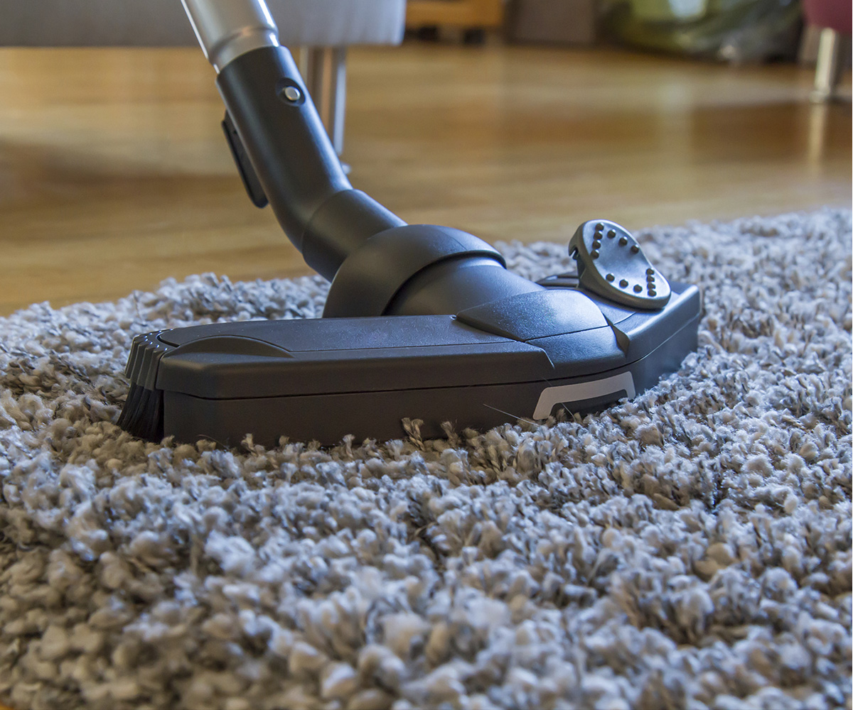 Vacuum cleaning a carpet
